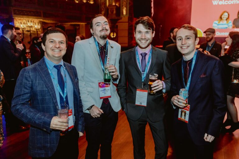 Photo of 3 Mini Mammoth Games' staff members and another attendee at the 2022 AGDA awards night